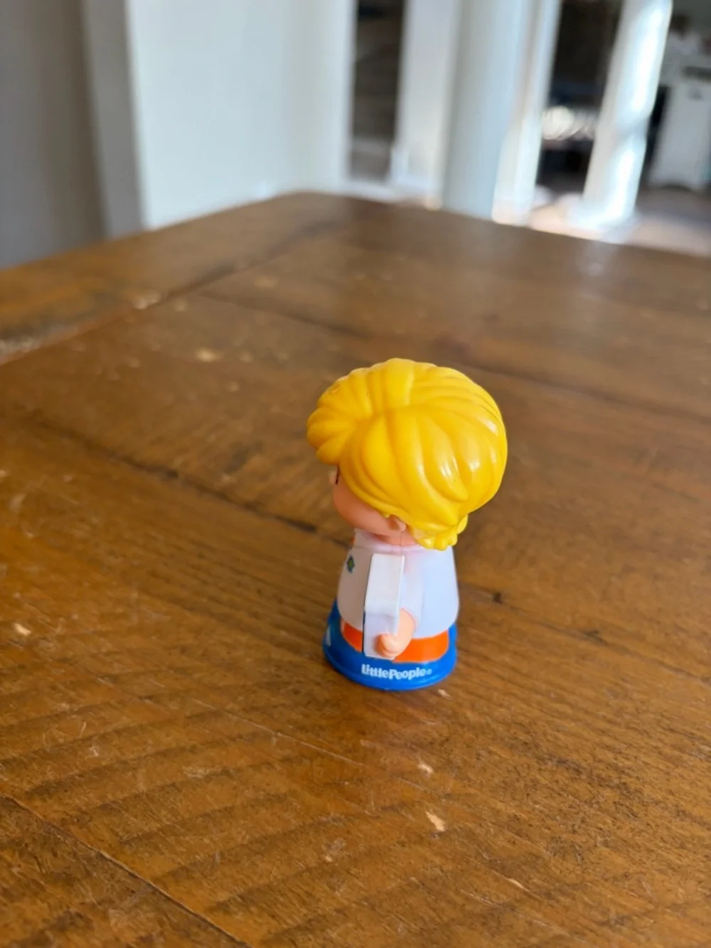 Fisher Price Little People Eddie with dinosaur book as is